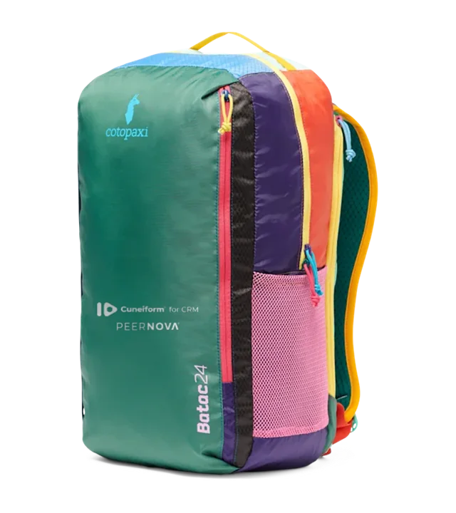 Cotopaxi Batac 24L Daypack in Del Día colors with the Cuneiform for CRM and PeerNova logos on the front